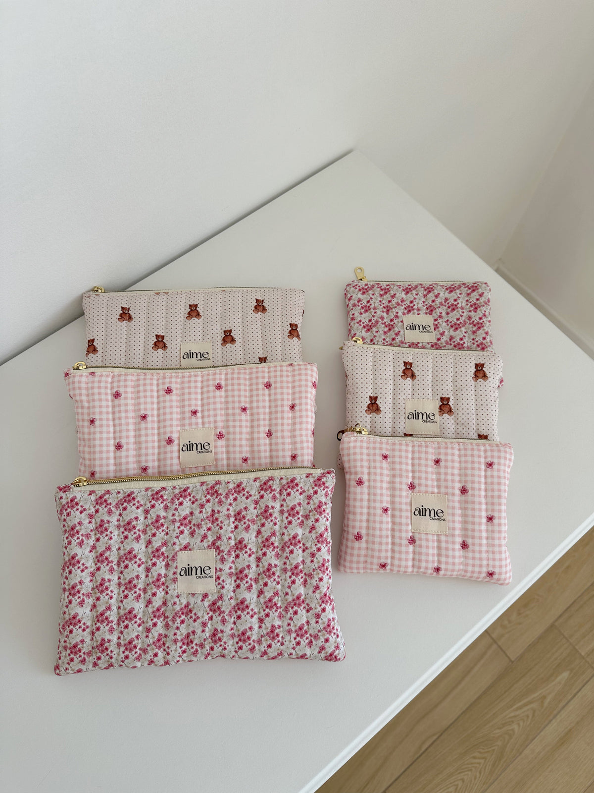 pochette artigianali in diverse fantasie sui toni del rosa