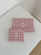 pochette artigianale con fiori sui toni del rosa