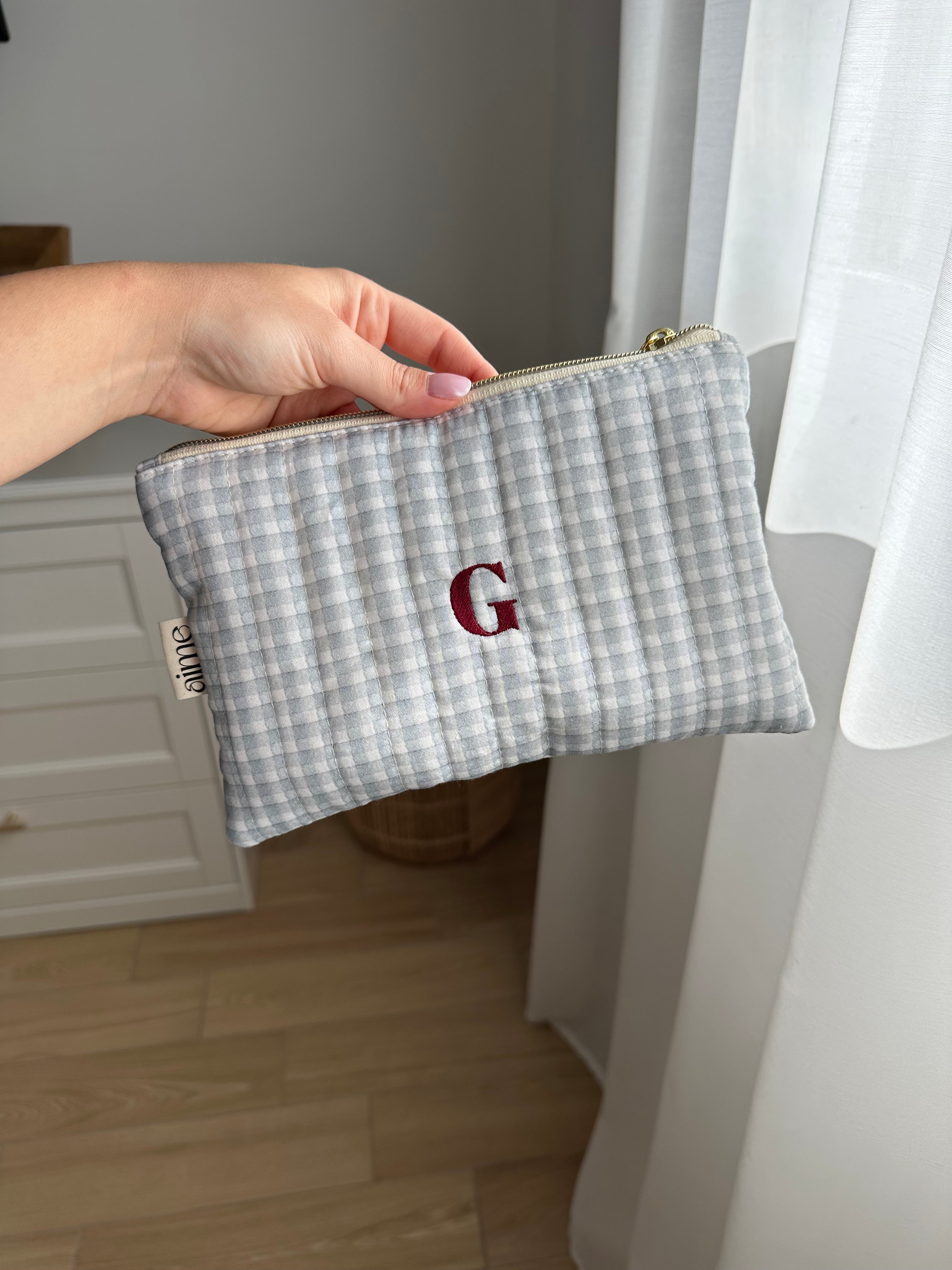 pochette a quadretto blu con ricamo
